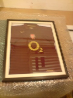 Arsenal signed and framed football shirt.
